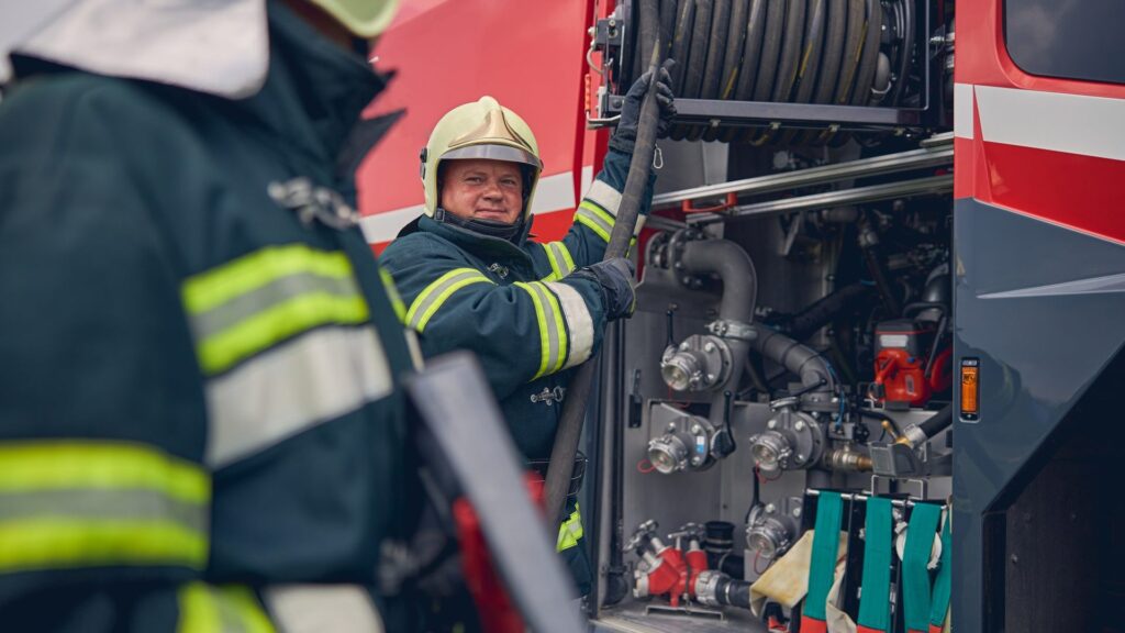 mature-firefighter-training-work-with-fire-equipment-e1697189294903.jpg